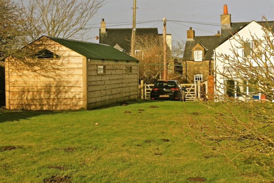 Garden, off road parking and a shed for dry storage