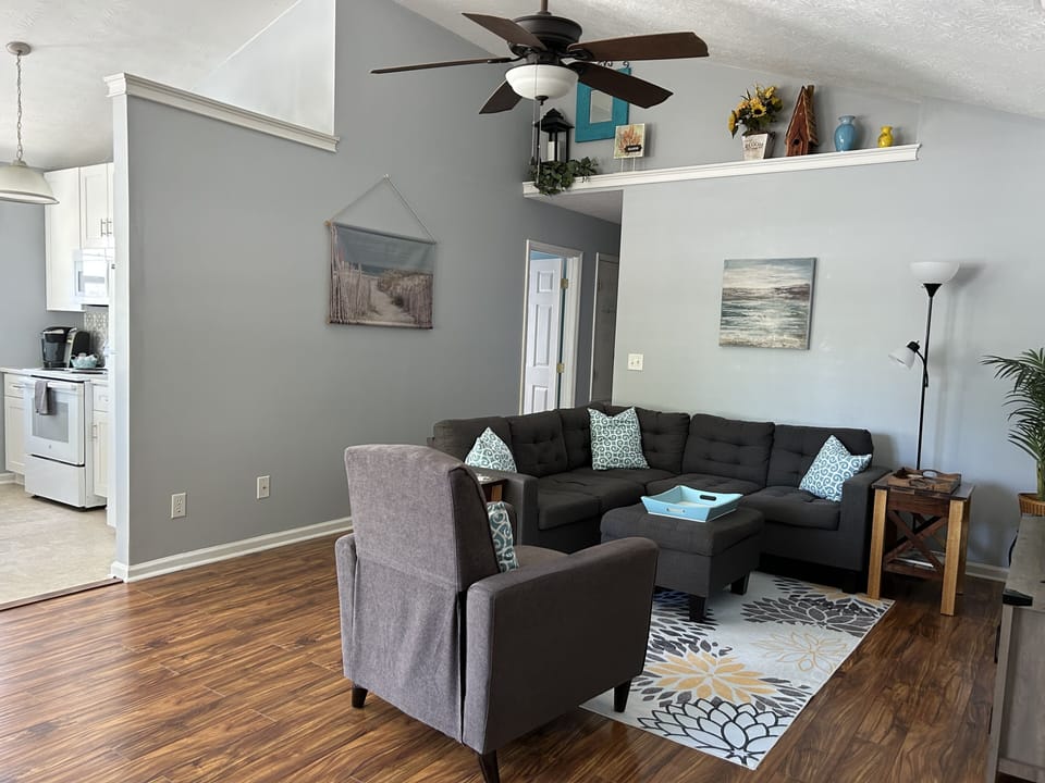 living room with soaring ceiling