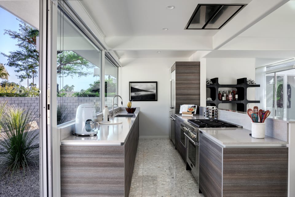 Fully equipped kitchen with stainless steel Thermador gas range & oven