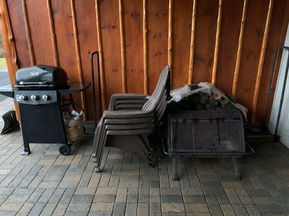Gas grill, ADK chairs and firepit with wood bin