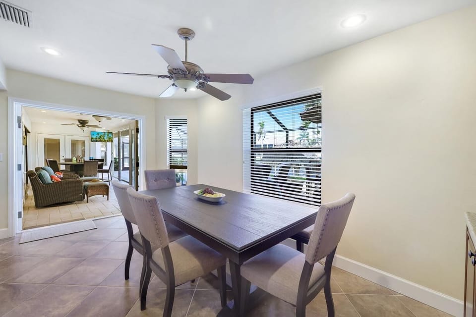 There is a casual Dining area overlooking the Kitchen and Pool Deck