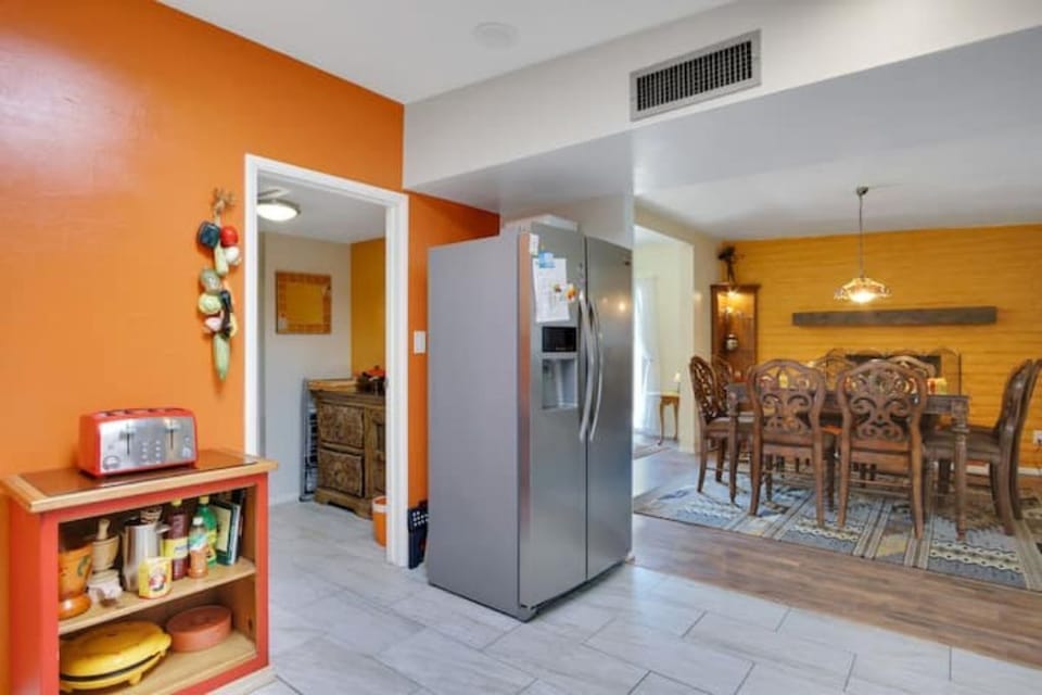 Plenty of room to work in the kitchen, and an 8 seat dining table. 
