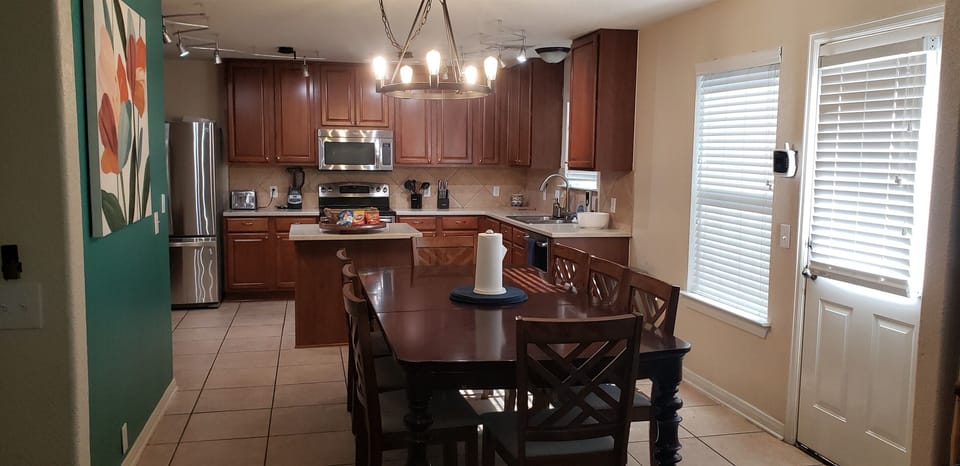 Have a seat at the elegant dining table and enjoy your favorite dishes surrounded by family and friends. Add the extra table leaf and chairs to make room for additional guests. There’s room for everyone at this table!