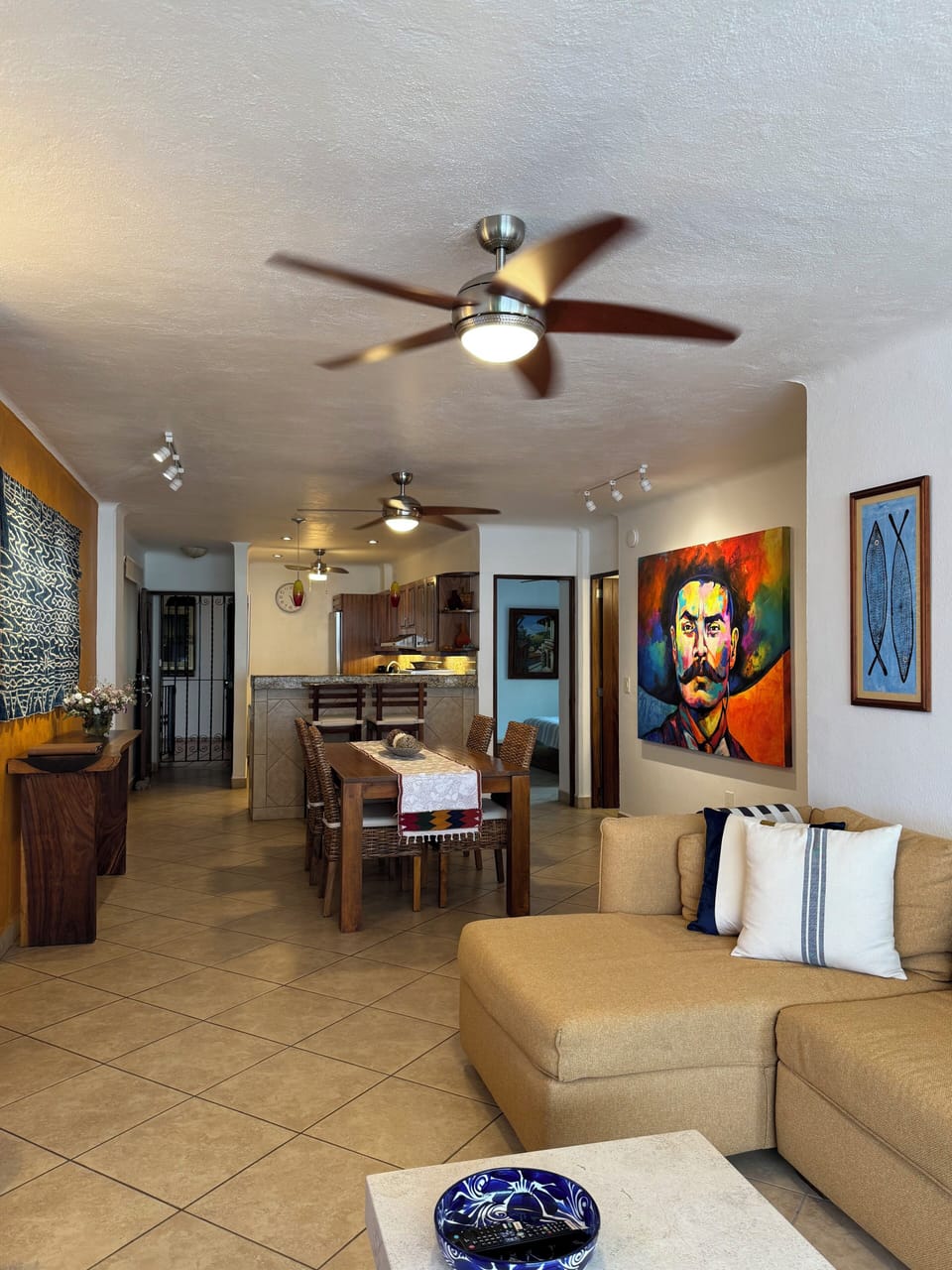 Full view of common living area. High quality furniture, many local art pieces