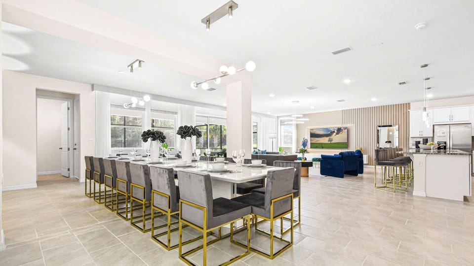 Spacious open-concept dining and living area with modern decor and natural light.