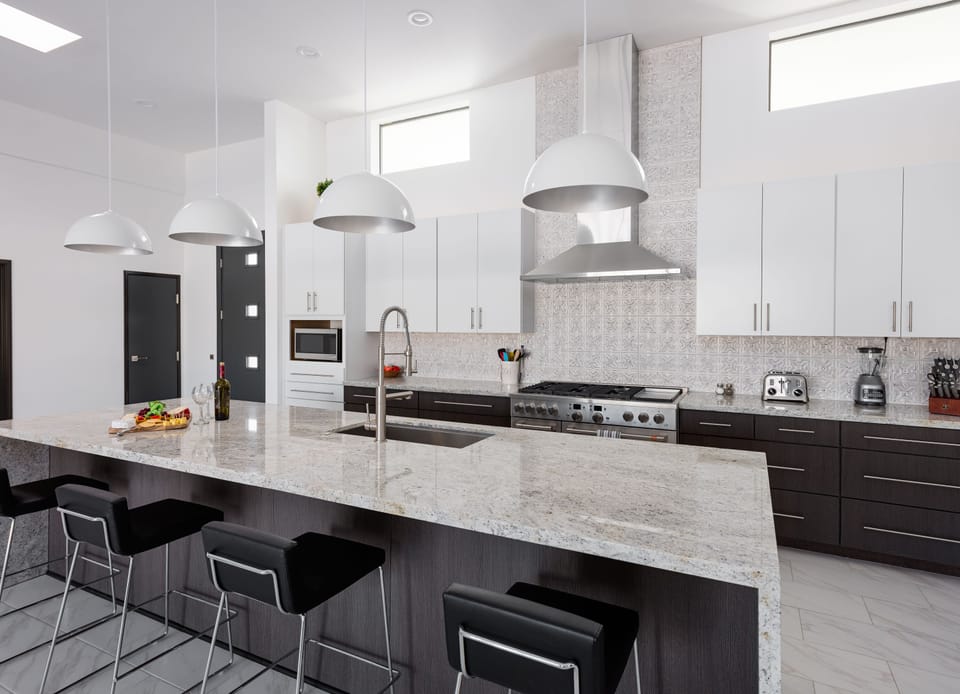 Fully equipped kitchen stocked with your basic cooking essentials, oversized island/breakfast bar and stainless-steel appliances.