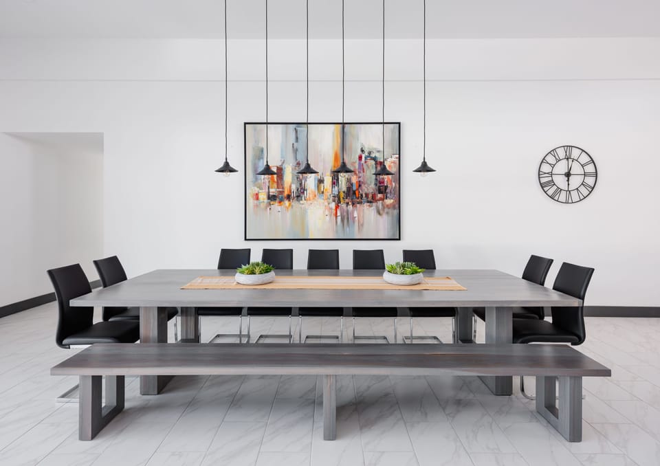 Formal dining room with oversized table and designer decor.