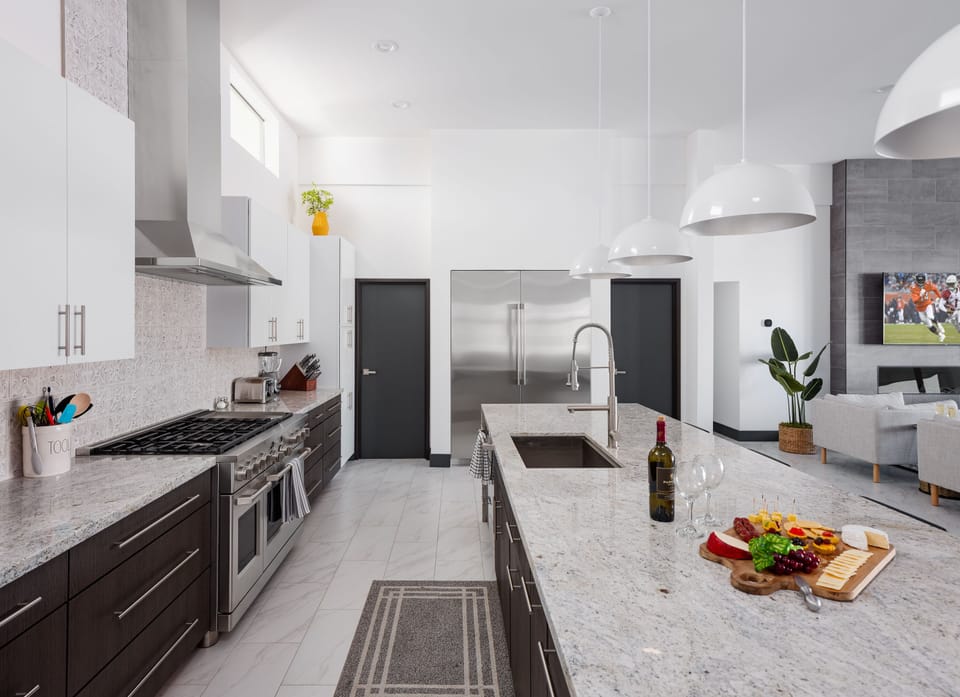Fully equipped kitchen stocked with your basic cooking essentials, oversized island/breakfast bar and stainless-steel appliances.