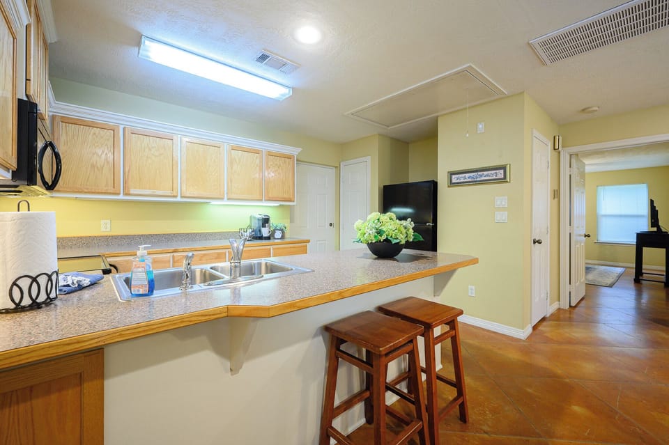 Full kitchen with loads of storage and counter space.