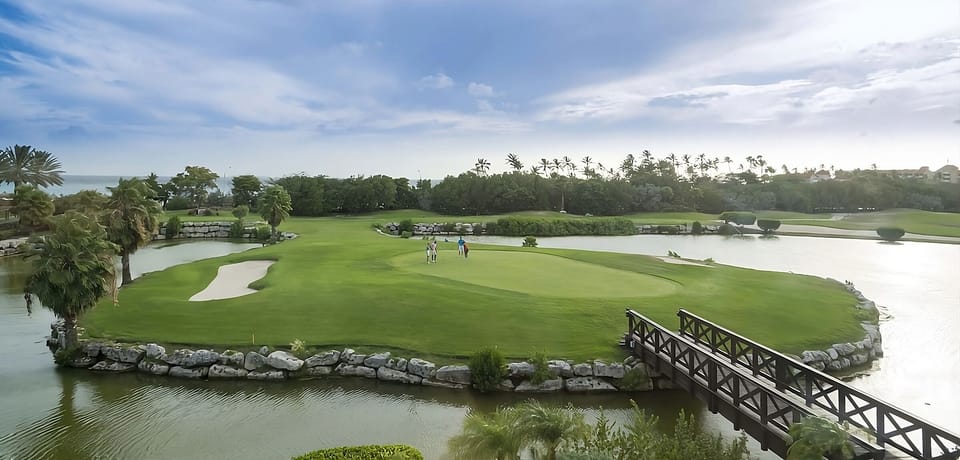 Breathe in open greens and water views steps from the resort.