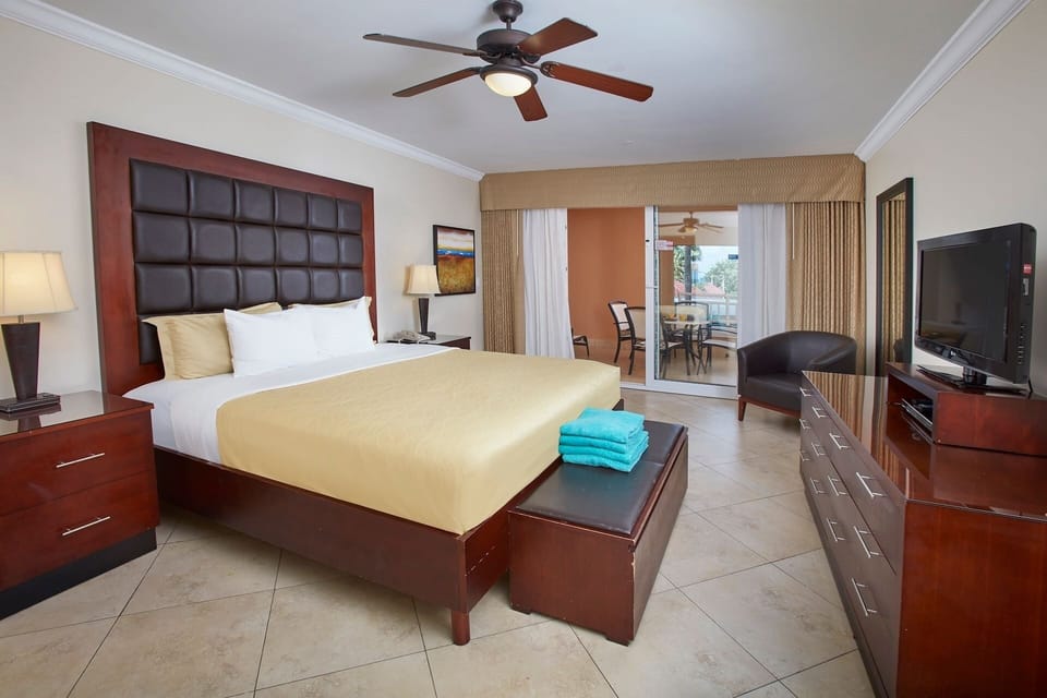 Unwind in a plush bed steps from fresh-air balcony.