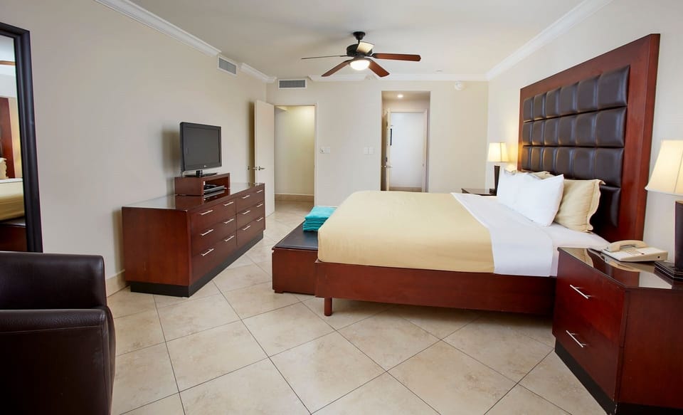 Unwind in a spacious king bedroom with ceiling fan.