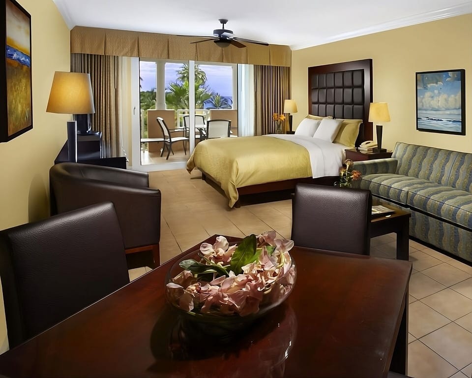 Wake up to airy comfort and balcony views beyond.
