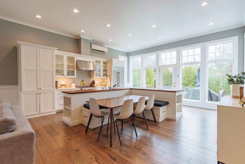 Gourmet Kitchen & Dining Experience: Our kitchen is a chef's delight, equipped with high-end Jenn-Air appliances that cater to all your culinary needs. The spacious layout features ample white cabinetry for storage, sleek countertops for meal prep, p