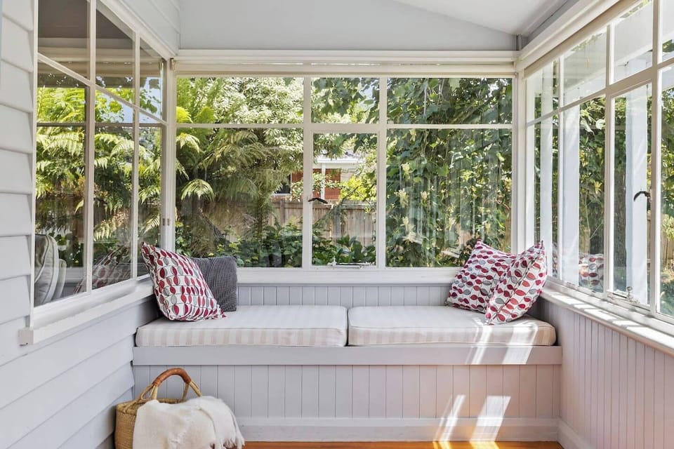 A built-in sunbed offers a cosy spot to read or relax, adding to the cottage's charm.
