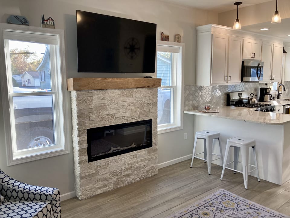 Living room with cozy electric fireplace and 55" smart TV