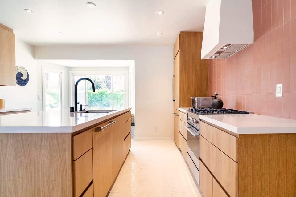 Newly renovated kitchen, white oak cabinets with Fisher and Paykel appliances. 