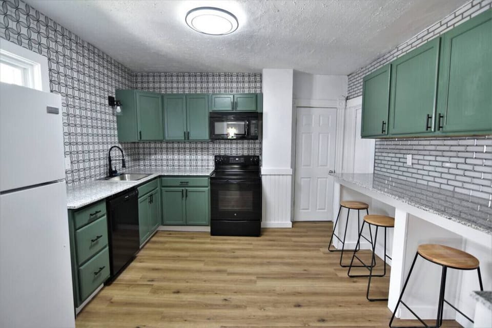 Colorful upstairs kitchen with counter-height seating