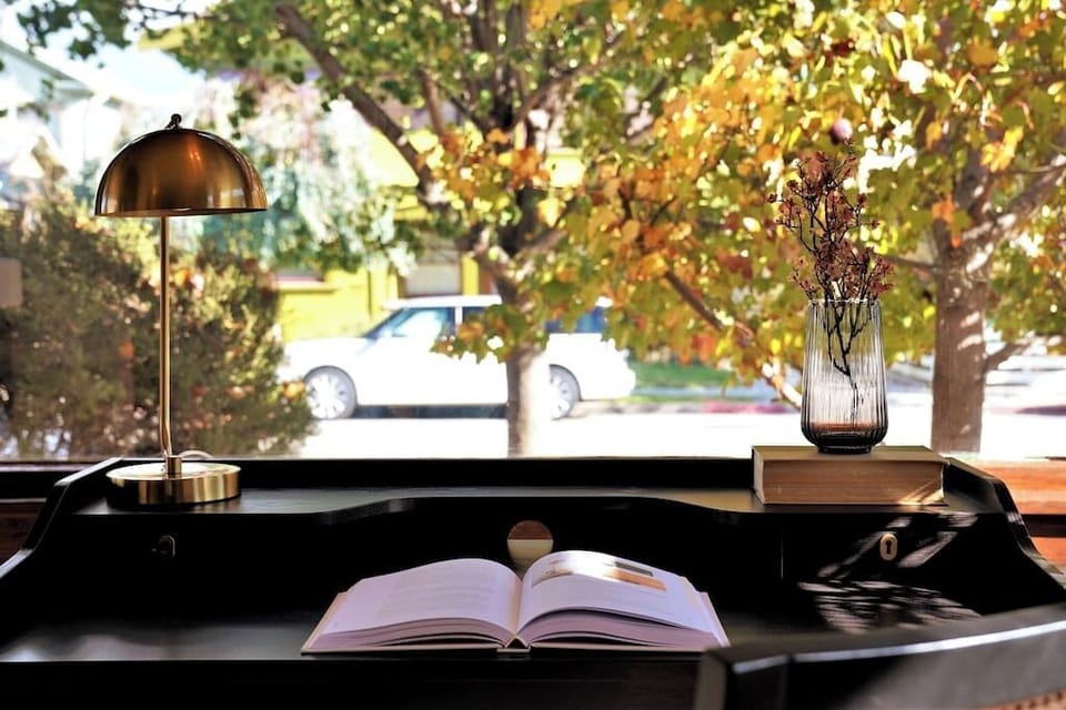 The dining area features another lovely work desk with charming views that might inspire your work.