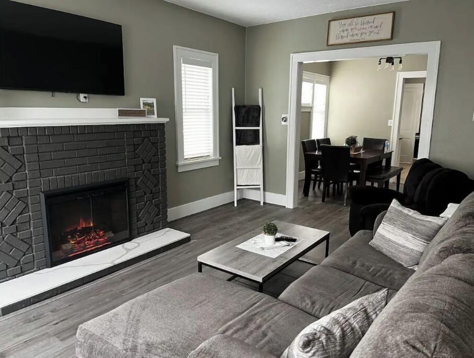 Living room with electric fireplace.