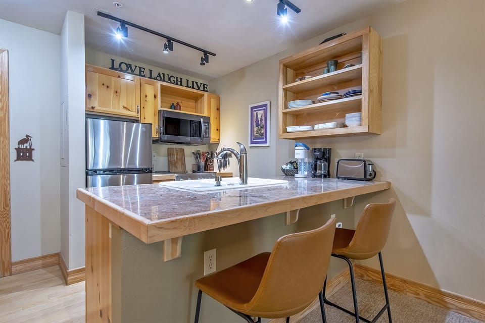 Compact yet mighty Kitchen is fully equipped and offers additional seating 