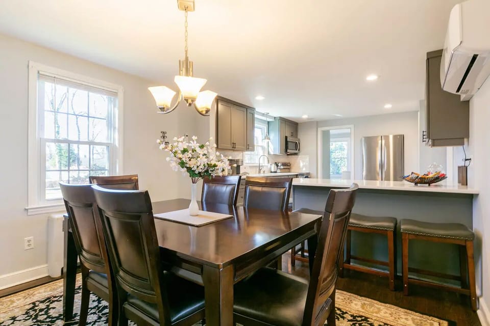 Dining room seats 6 and expands for 8 with leaf.