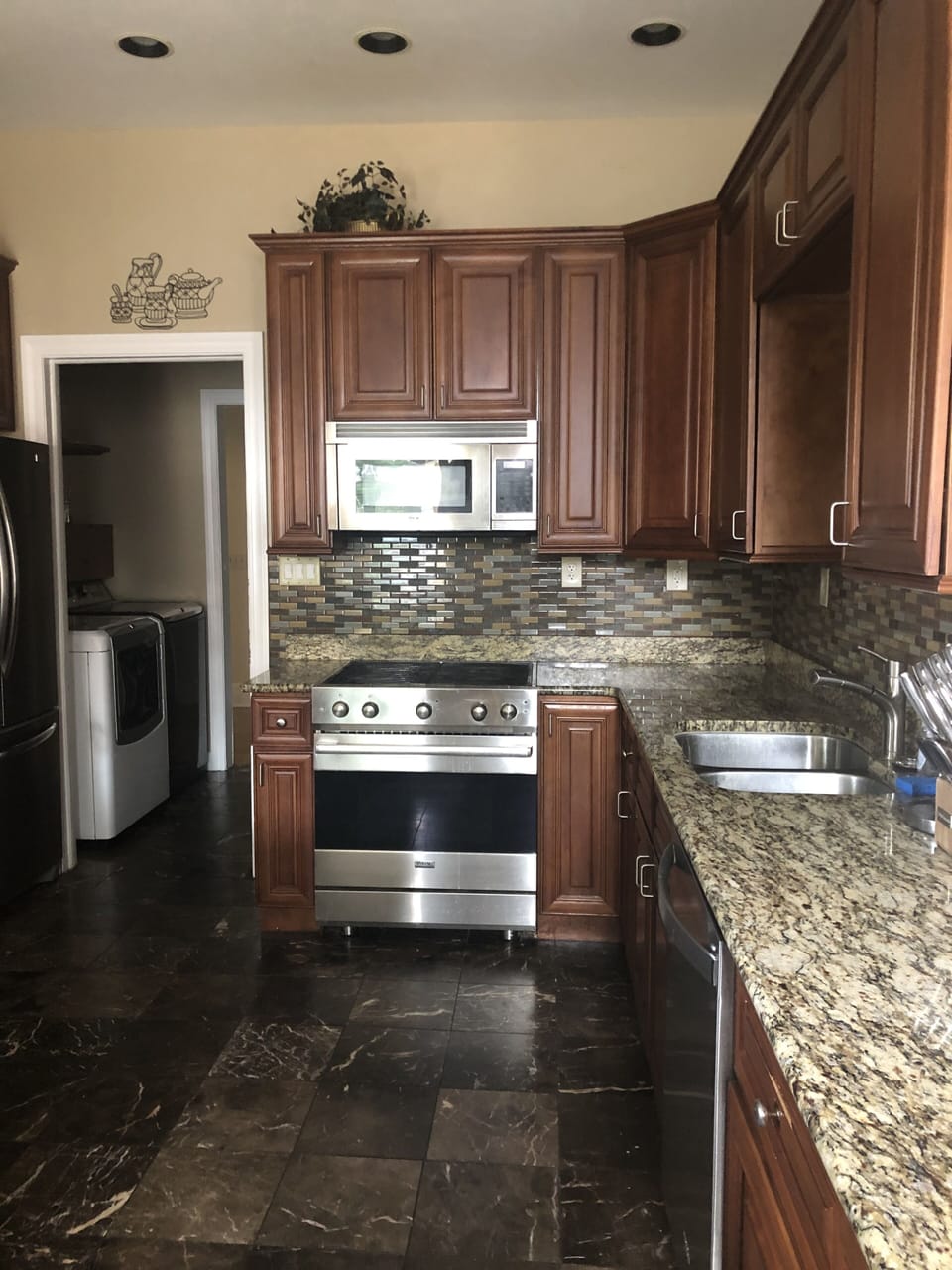 Kitchen w/double sink, garbage disposal, Viking gas stove, and dishwasher
