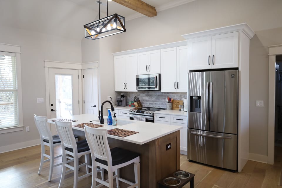 Full Kitchen.  Sits 3 at the counter.  Oven, stove, microwave and refrigerator.