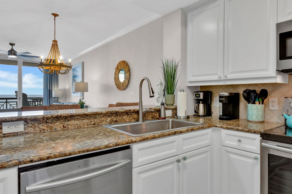 Granite countertops and stainless appliances in kitchen