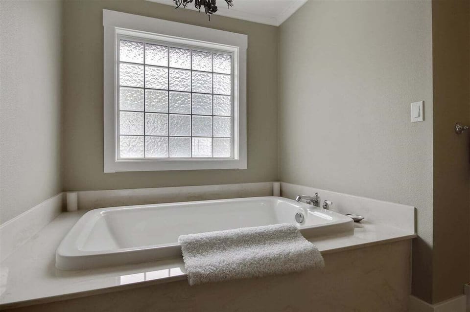 Primary Bathroom Tub at The Loft