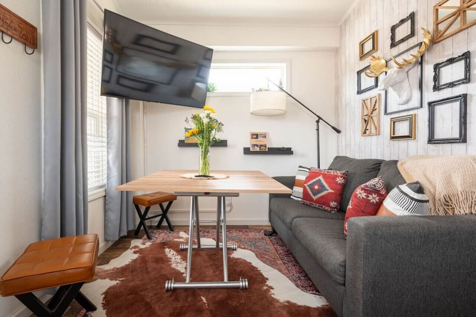 Cozy up in our charming living room, where comfort meets style! Perfect for movie nights or a quiet read.