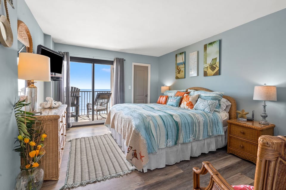 Bedroom with balcony doors and an ocean view at Springs Towers 705, a 3-bedroom Cherry Grove vacation rental
