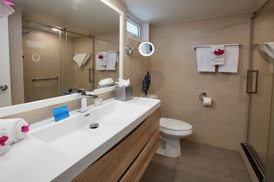 Start your day at a sleek vanity with bright mirror lighting.