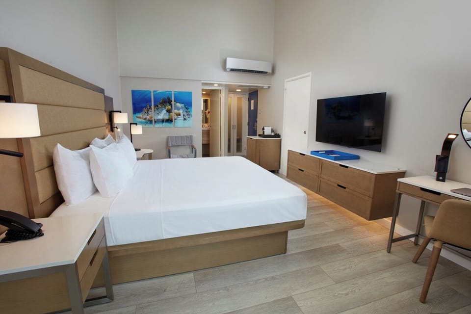 Stretch out with ample space, big TV, and calm décor.