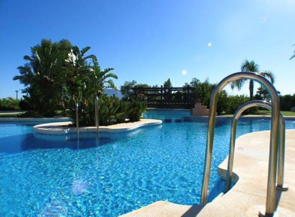 Communal swimming pools with adjacent kiddies´ pools.