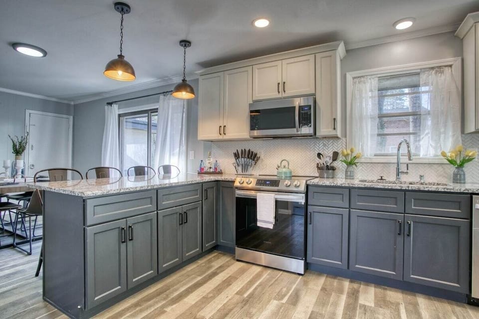 Cook in style in our modern open kitchen, blending sleek design with functional elegance.