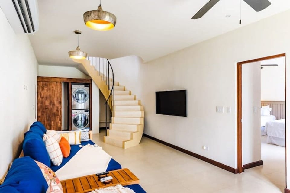 Living space with tv - laundry area