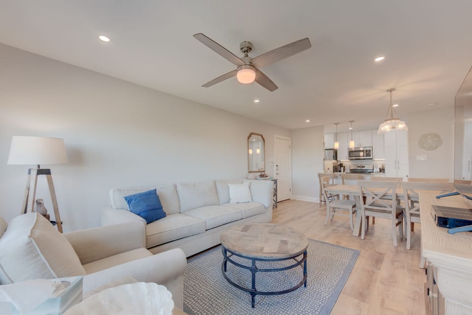 Living Area - Step into a beautifully decorated condo that perfectly blends style, comfort, and coastal elegance.