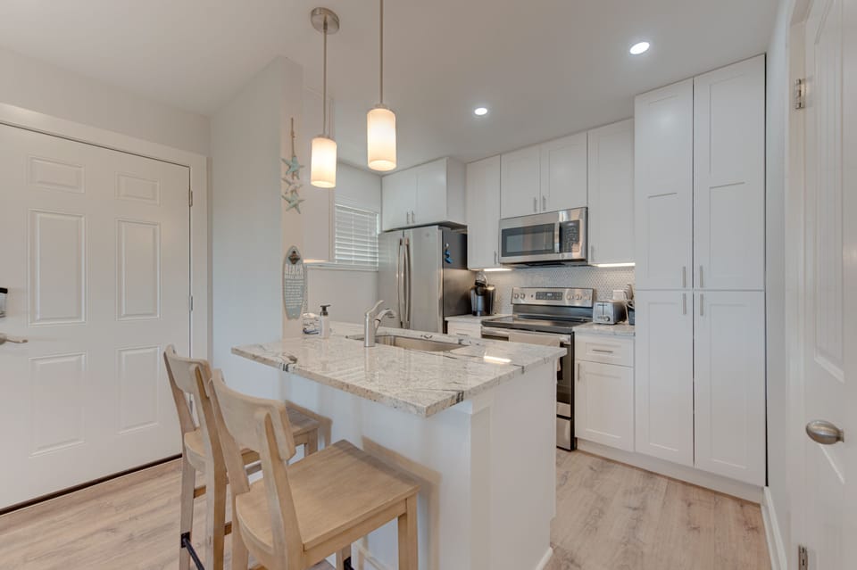 Kitchen - Cook, create, and connect — experience culinary charm in this cozy vacation haven.