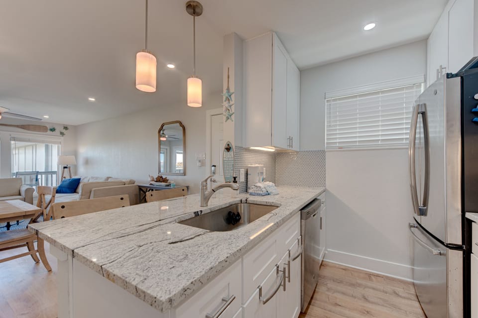 Kitchen - Experience the perfect blend of function and style with expansive countertops and abundant kitchen storage.