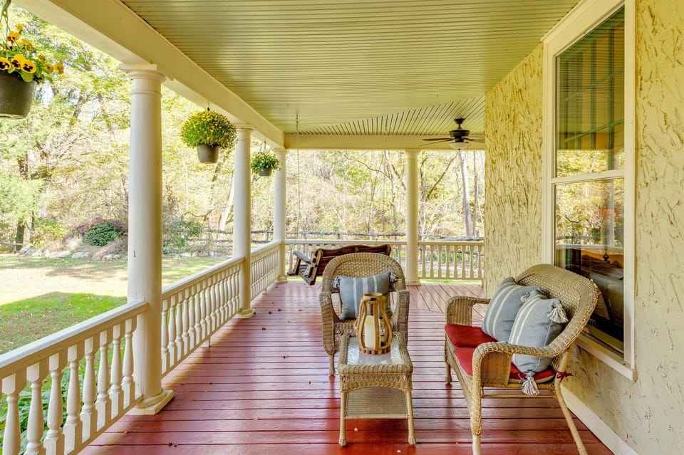 Front porch living with lots of seating. Take a pause, listen to thebirds