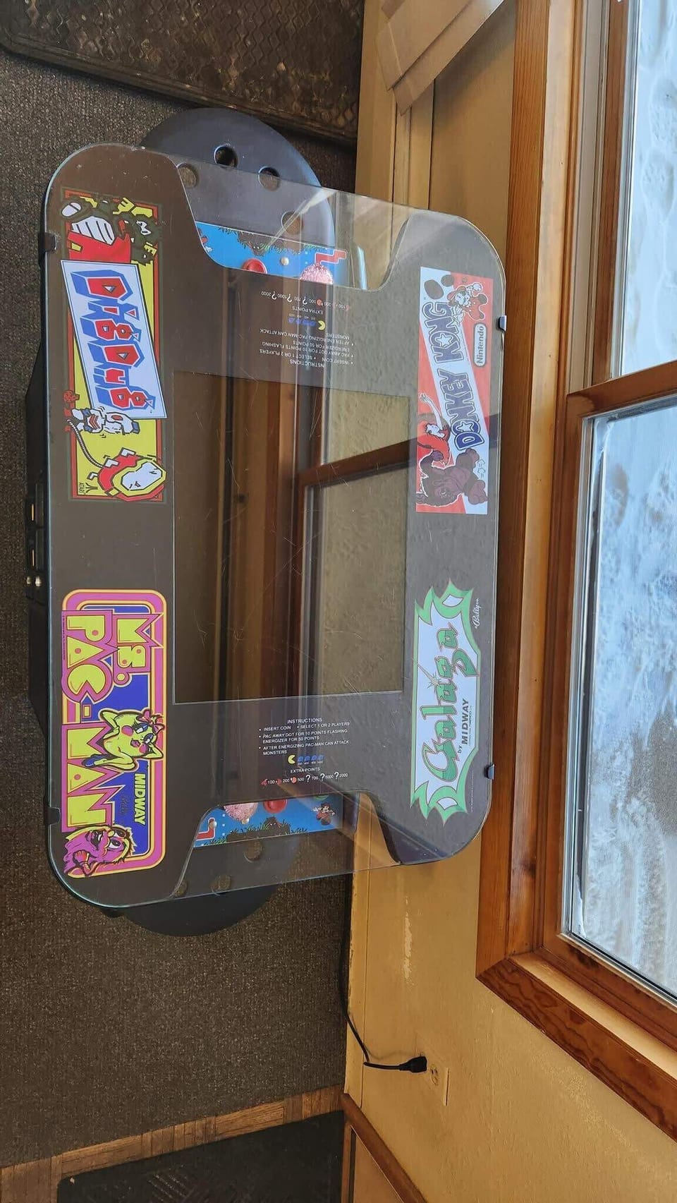 Enjoy some rounds of Ms. Pac-Man and Donkey Kong on the arcade table located next to a window in the front of the home with views over French Street.