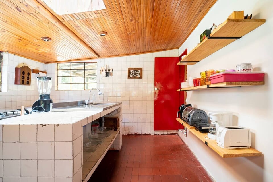 Kitchen fully equipped with appliances, and oven and gas stove