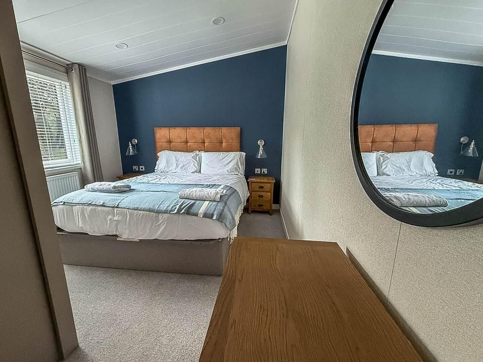 The lodge bedroom is designed to feel like a home away from home.
