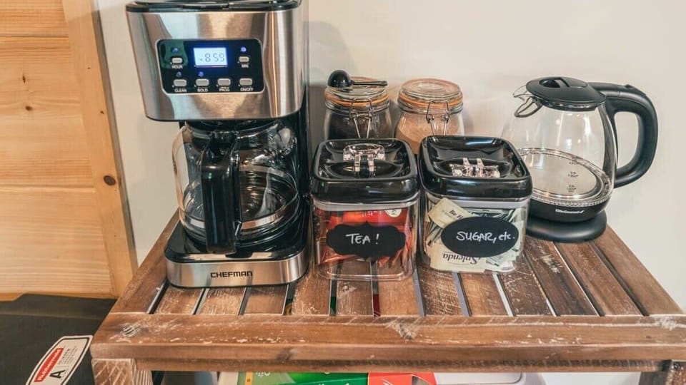 Coffee maker and kettle along with tea, sugar, and ground coffee all supplied for our guests