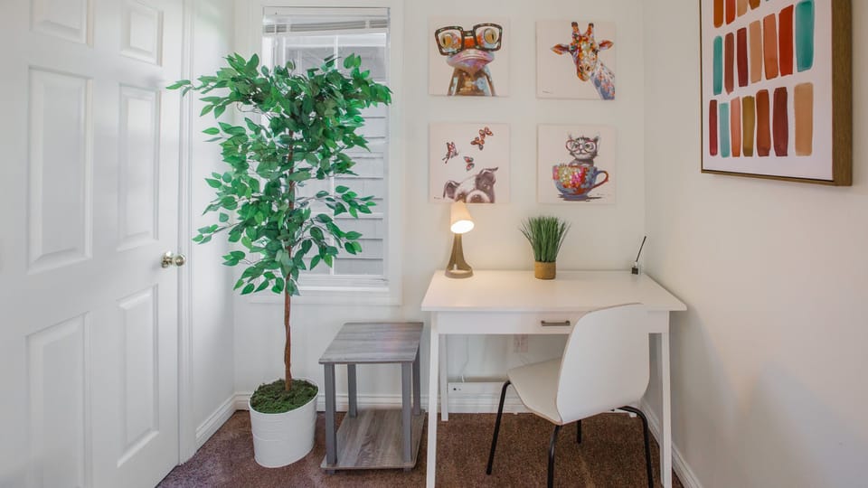 Twin trundle third bedroom with desk area and natural light. Quiet area at the back of the house
