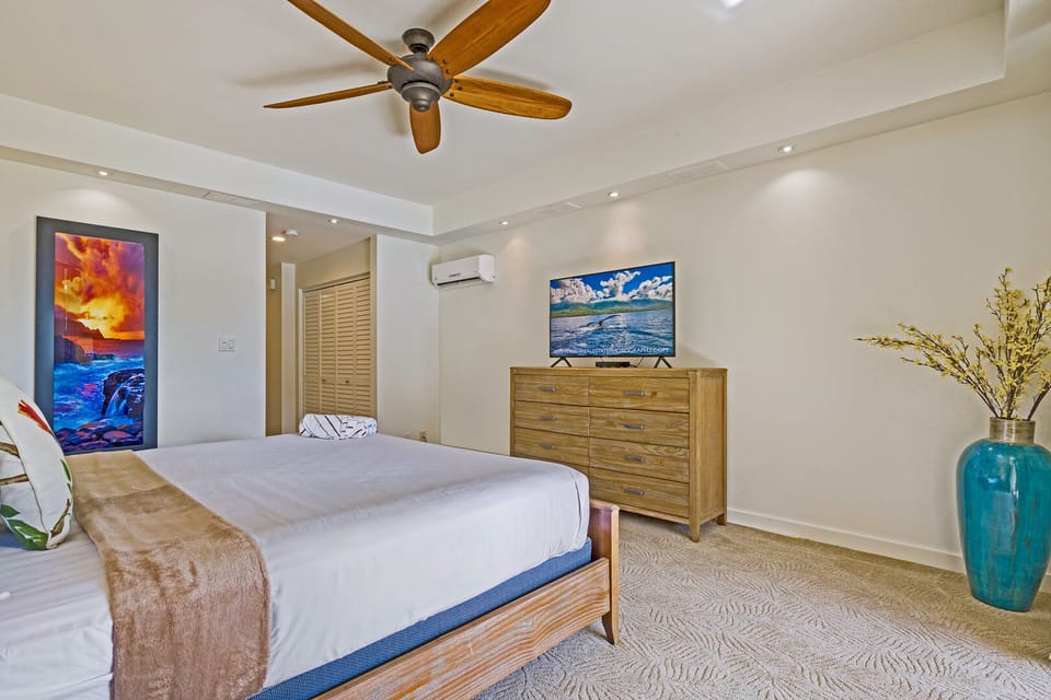 Restful bedroom retreat featuring a king bed, stylish furnishings, smart TV, and A/C—perfect for unwinding after a beach or hiking adventure.