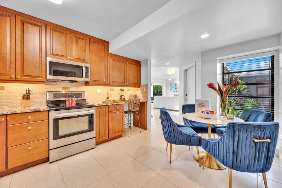 Kitchen includes all appliances and has a four person dining table