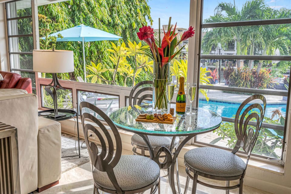 The dining area is located between the kitchen and the living area, and features seating for three people.