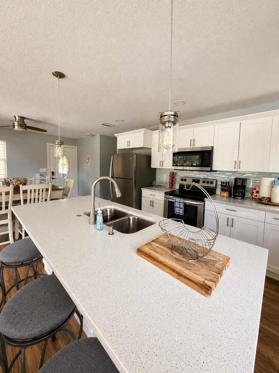 microwave, indoor dining, island, kitchen, oven, refrigerator, dining table